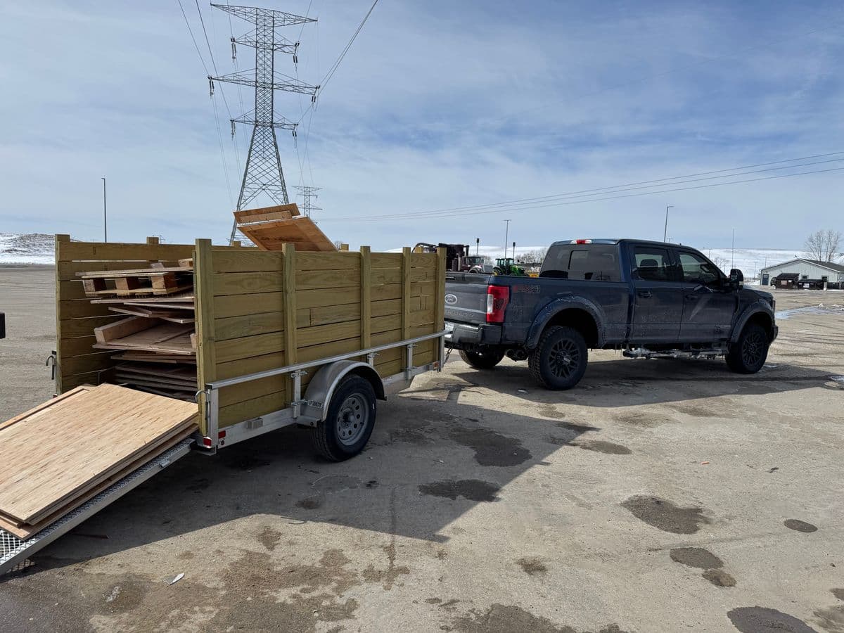 EZ Junk Hauling truck and trailer loaded for junk removal in Rockford IL